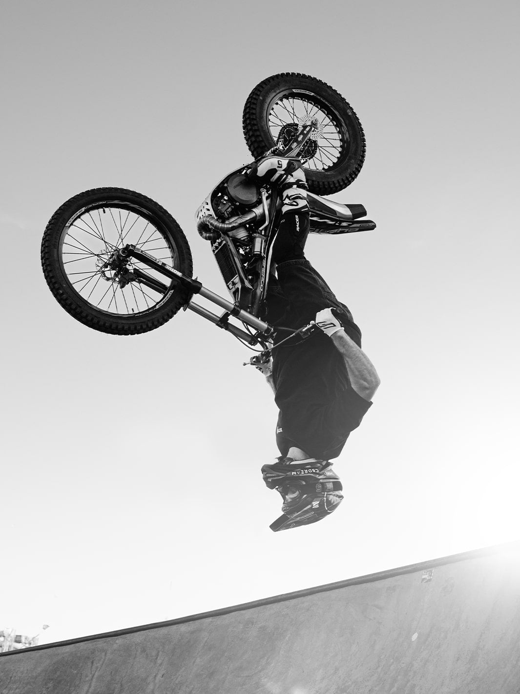 Kenny Thomas on a motorcycle at a skatepark