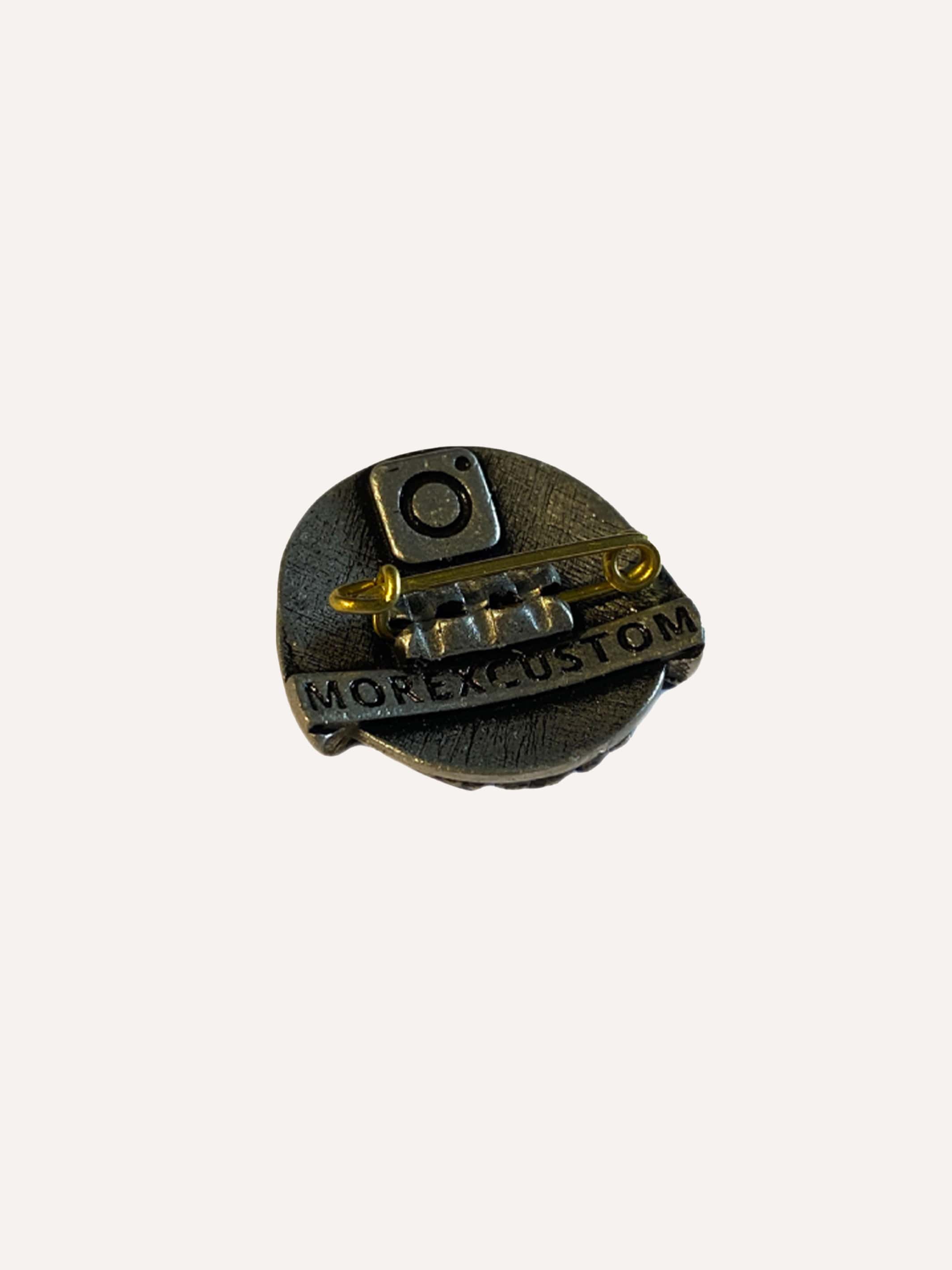 Pewter brooch